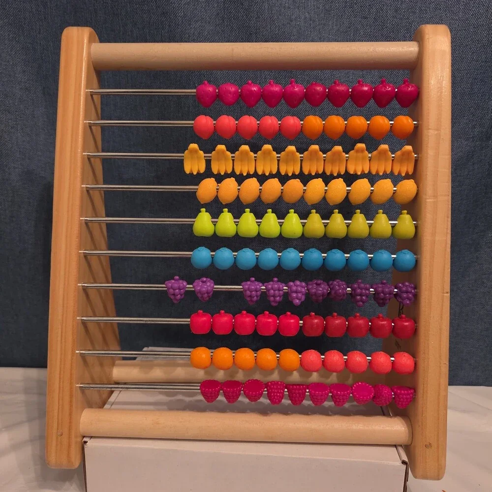 B. Toys Two-Ty Fruity Wooden Abacus Toy Textured Fruit Counting Math Board